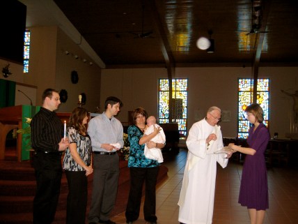 During the ceremony...Trying to keep Baby B happy!