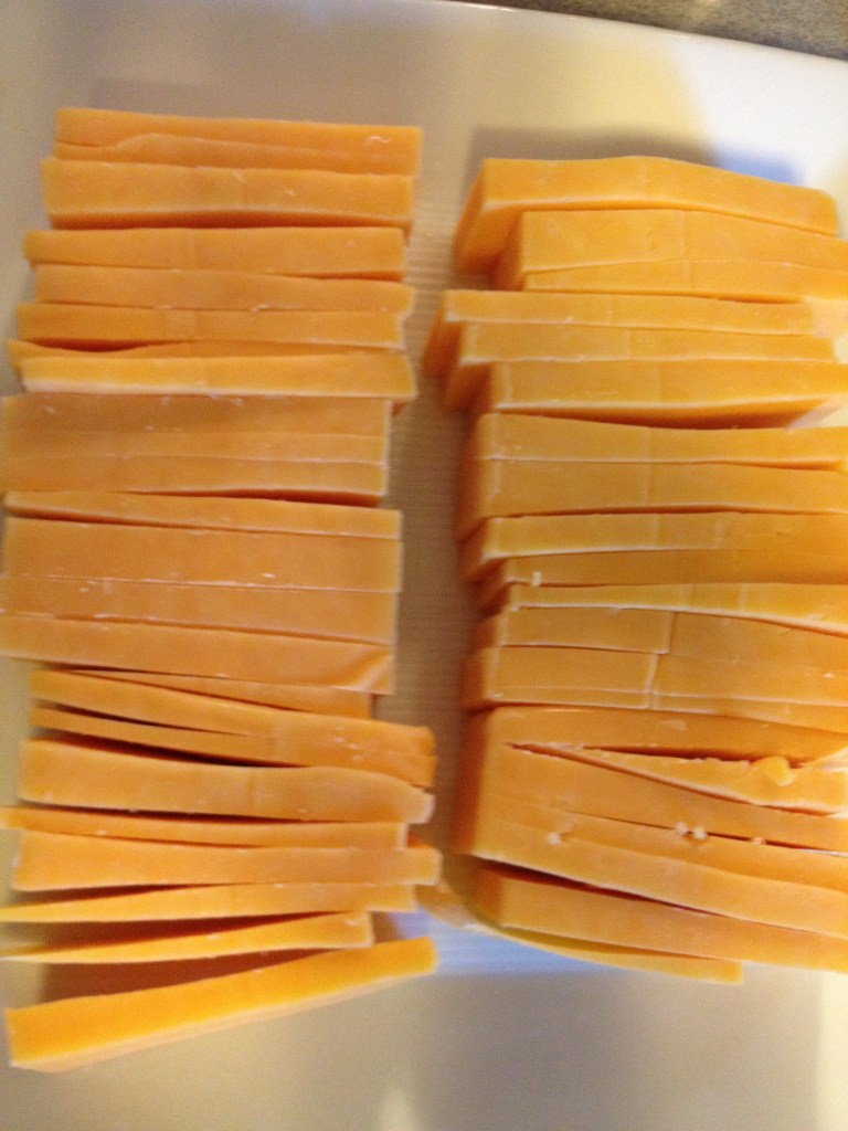 We sliced up some sharp cheddar and some mild cheddar.  Turned out KIRBY LOVES CHEESE!