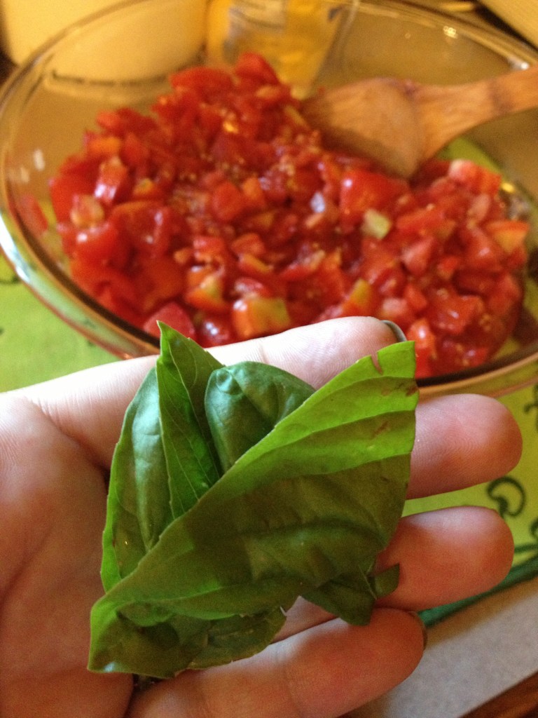 Time to add the fresh basil.  Punky went and got some from the  herb garden under the apple tree...and voila!
